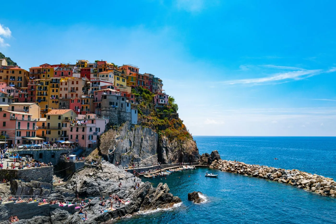 Architecture: colourful terraced houses on a cliff above a harbour